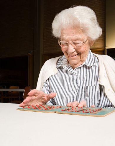 elderly woman playing bingo