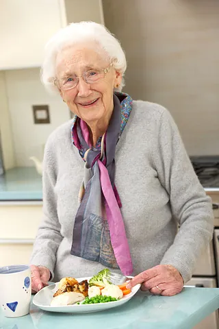elderly woman eating